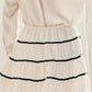 Get ready to up the style ante with the Glam Lifestyle Skirt. Featuring accent bow detailing and an elastic waistband, this skirt is both functional and fashionable. Plus, it's lined for added comfort. Upgrade your wardrobe and show off your unique and playful sense of style!
