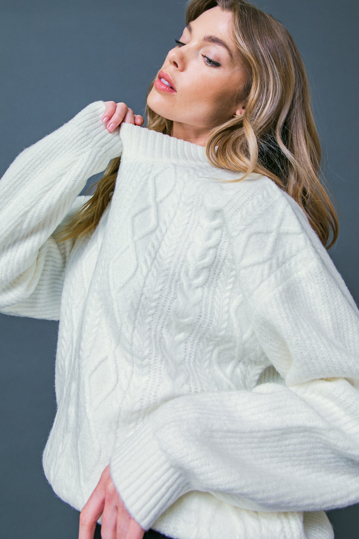 Make your fairytale dreams come true with this Snow White inspired knit. With a mock neck, long sleeve, and relaxed body, this sweater will have you feeling cozy and cute! 