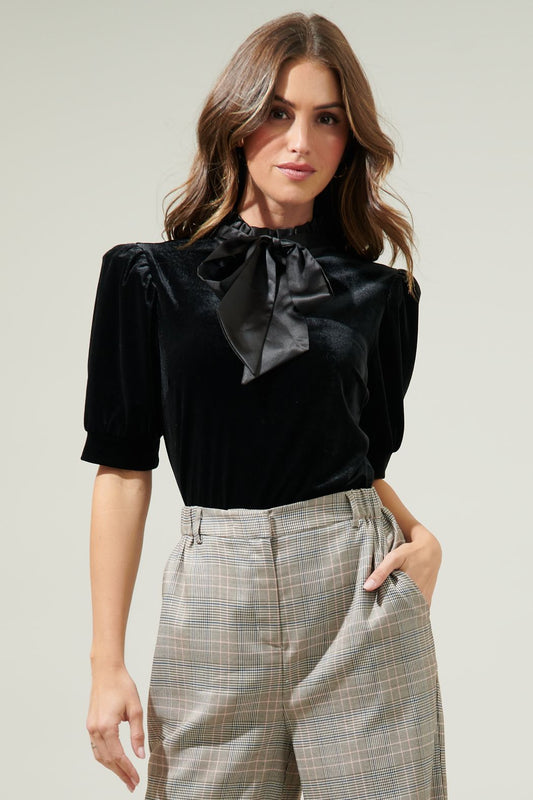 Made from soft velvet material and the satin bow tie detail adds a touch of elegance to the overall design. The zipper closure at the back ensures a comfortable and secure fit, while the high-quality materials ensure durability and long-lasting wear.