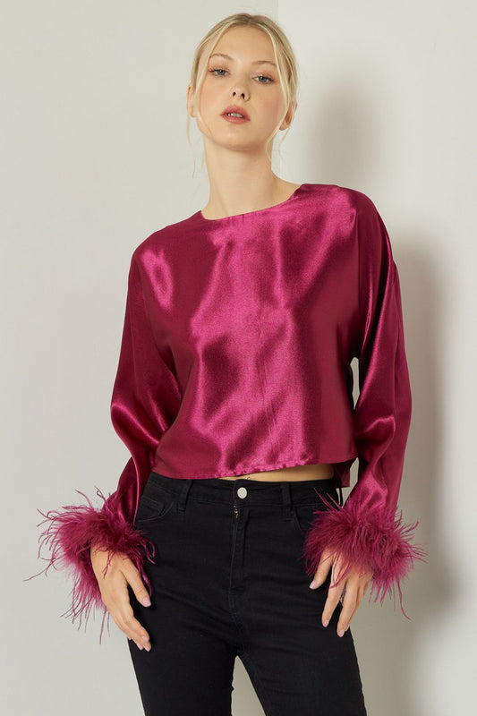 Look super fly in this satin Dream On Top! Featuring faux feather trim and self-tie closures, you'll be the life of the party. Plus, it's lightweight so you can dance all night with ease! Dream big and fly high!