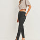 Elevate your denim game with the JUST BLACK DENIM Mid Rise - Split Hem Slim Jeans. The mid rise design offers a flattering fit that sits comfortably on your hips, creating a sleek and modern silhouette that effortlessly complements your shape. 10.5" rise and a 30" inseam. The 7" split hem adds a dash of flair and timeless appeal. Pair these jeans with your favorite heels for an elevated look, or embrace a more laid-back vibe with sneakers or ankle boots. 