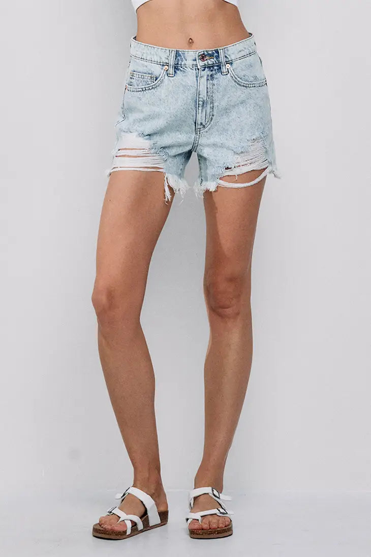Take Me to the Beach' High Rise Distressed Denim Shorts. This distressed short features a frayed hem. The high-rise design offers a flattering fit that accentuates your curves while providing a comfortable and confident feel. The zipper front with button closure ensures a secure and stylish fit. Wear them with your favorite bikini top or a breezy beach cover-up 