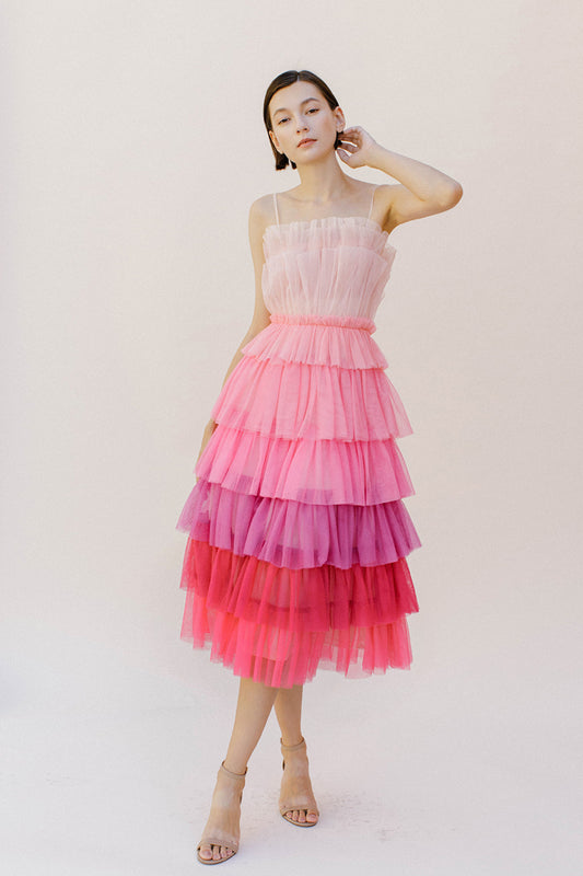 This exquisite pink-hued ombre tulle midi dress features convenient adjustable spaghetti straps, an enchanting tiered ruffled layers top, and a cinched waist for an alluring silhouette. It is complete with a midi layered bottom and a subtle back invisible zipper.