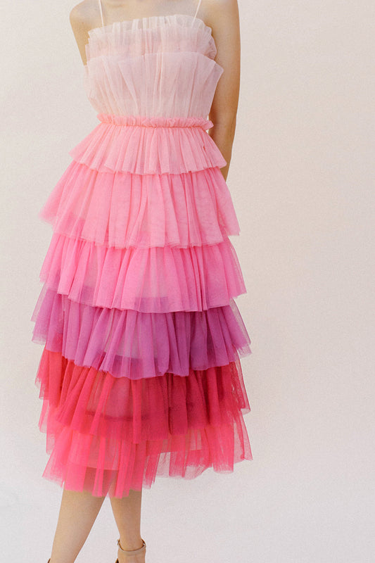 This exquisite pink-hued ombre tulle midi dress features convenient adjustable spaghetti straps, an enchanting tiered ruffled layers top, and a cinched waist for an alluring silhouette. It is complete with a midi layered bottom and a subtle back invisible zipper.