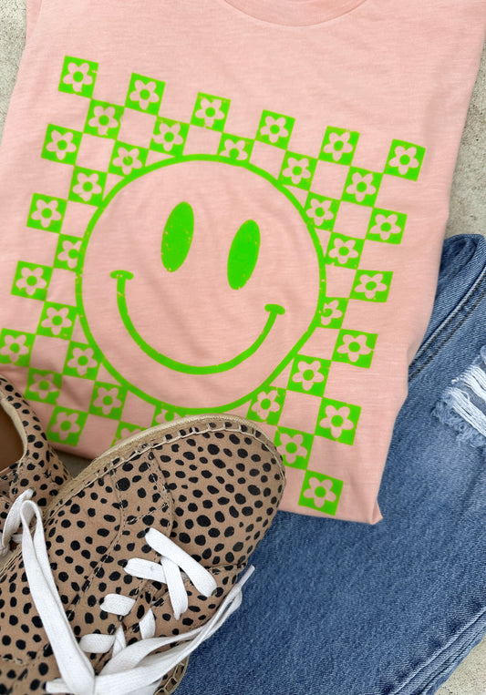 Step into a world of cheerful nostalgia with our 'All Smiles' Tri-Blend Extra Soft Short Sleeve Tee. This vibrant creation combines the softness of tri-blend fabric with a bold, larger-than-life green smiley face, embracing the essence of happiness and effortless style.  Crafted from a premium tri-blend fabric makes this tee super soft. You will never want to take if off!